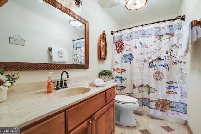 bathroom featuring tile patterned flooring, visible vents, vanity, and toilet