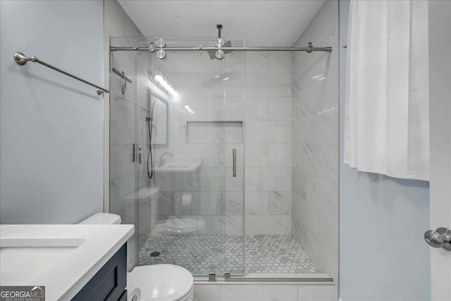 full bath with a shower stall, toilet, and vanity