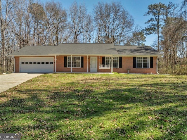 single story home featuring brick siding, a porch, a front yard, a garage, and driveway