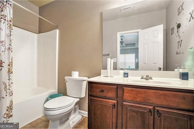 bathroom with visible vents, toilet, shower / tub combo, vanity, and tile patterned flooring