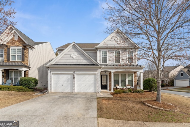 702 Berkeley Ter, Canton, GA 30115 - traditional-style home featuring a porch, a standing seam roof, concrete driveway, an attached garage, and metal roof