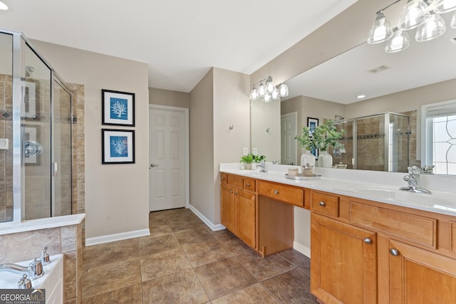 702 Berkeley Ter, Canton, GA 30115 - bathroom with a stall shower, double vanity, a bath, baseboards, and tile patterned floors