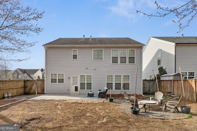 702 Berkeley Ter, Canton, GA 30115 - back of property featuring a fire pit, a patio area, and a fenced backyard