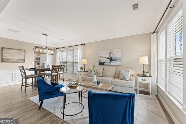 702 Berkeley Ter, Canton, GA 30115 - living area featuring ornamental molding and light wood-style floors