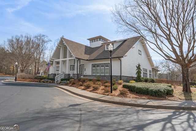 702 Berkeley Ter, Canton, GA 30115 - view of front of house featuring stone siding and a shingled roof
