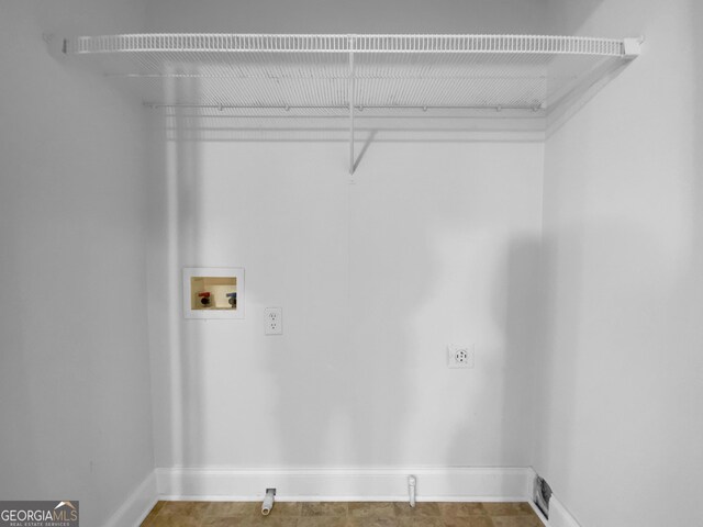 641 Morningside Dr, Stockbridge, GA 30281 - clothes washing area with hookup for a washing machine, baseboards, and laundry area
