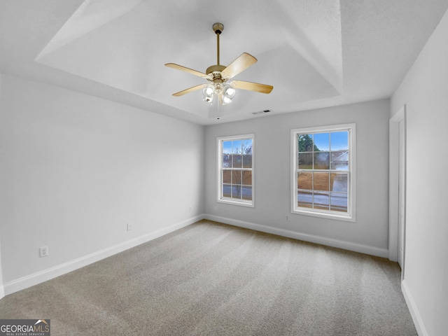 641 Morningside Dr, Stockbridge, GA 30281 - spare room with carpet flooring, a raised ceiling, visible vents, and baseboards