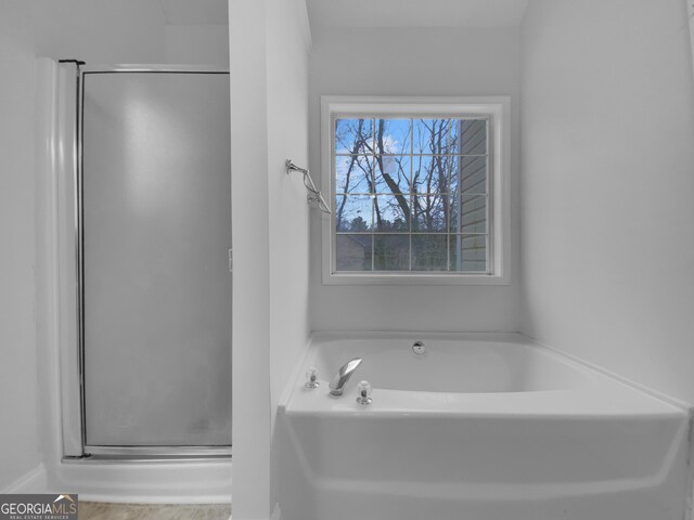 641 Morningside Dr, Stockbridge, GA 30281 - bathroom featuring a shower stall and a bath
