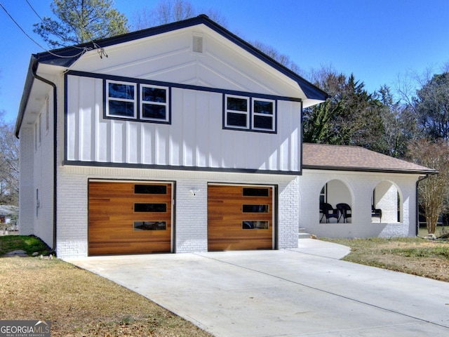 view of home's exterior featuring driveway, an attached garage, and brick siding