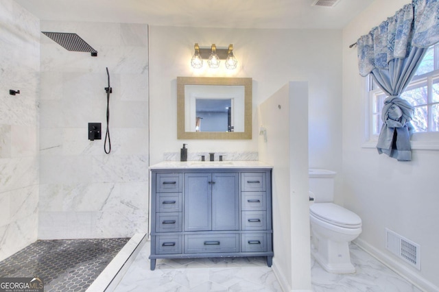 bathroom featuring marble finish floor, visible vents, vanity, and toilet