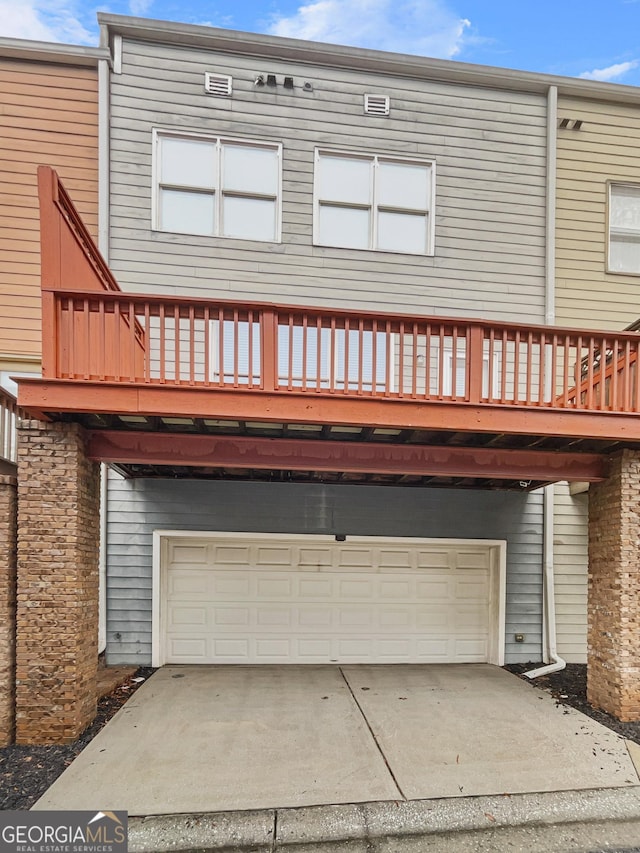 exterior space featuring driveway and an attached garage