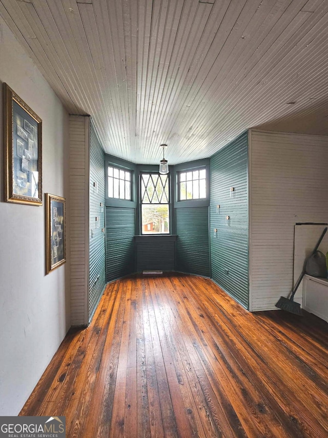 interior space with dark wood-style floors and wooden ceiling