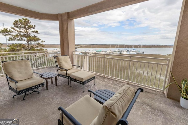 balcony featuring a water view