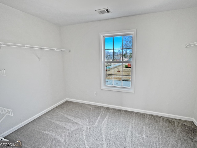 spacious closet featuring carpet and visible vents