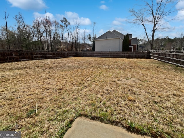 view of yard with a fenced backyard