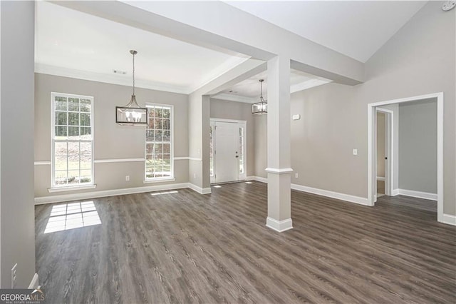 interior space featuring baseboards, dark wood-style flooring, and an inviting chandelier