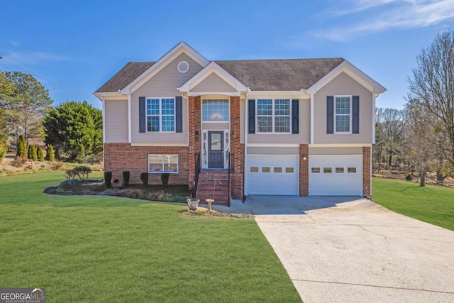 bi-level home with a front yard, brick siding, driveway, and an attached garage