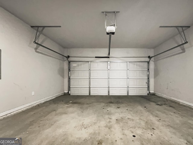 garage featuring baseboards and a garage door opener