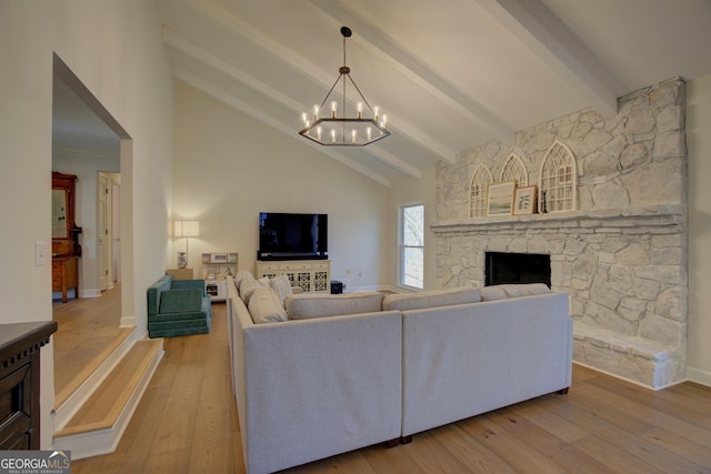 living room with beam ceiling, a fireplace, high vaulted ceiling, a chandelier, and hardwood / wood-style flooring