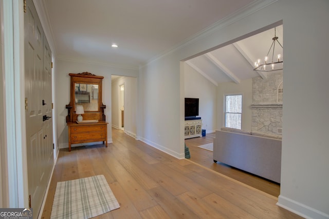 hall with lofted ceiling with beams, baseboards, hardwood / wood-style flooring, and crown molding