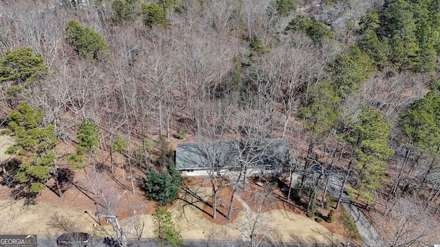 aerial view featuring a view of trees