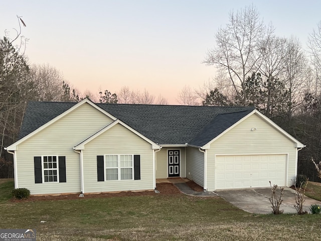 single story home featuring driveway, a front lawn, roof with shingles, and an attached garage