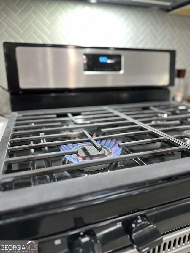 interior details featuring stainless steel range with gas stovetop