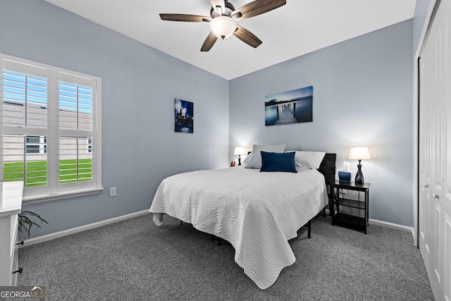 carpeted bedroom featuring ceiling fan, baseboards, and a closet