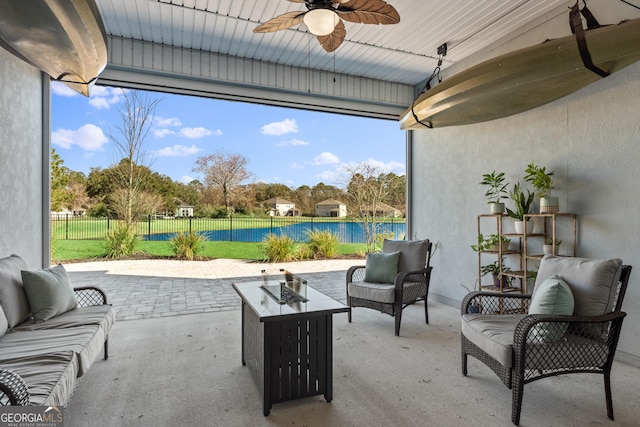 view of patio / terrace with ceiling fan, a fenced backyard, and an outdoor living space