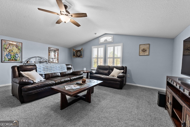 carpeted living room with vaulted ceiling, a textured ceiling, a ceiling fan, and baseboards