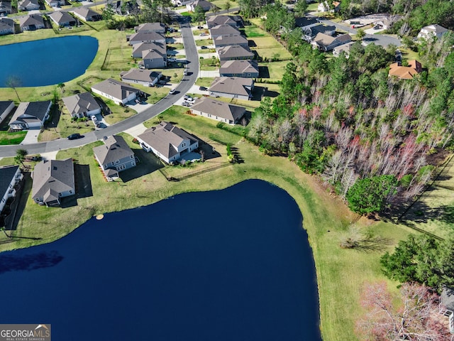 aerial view with a water view and a residential view