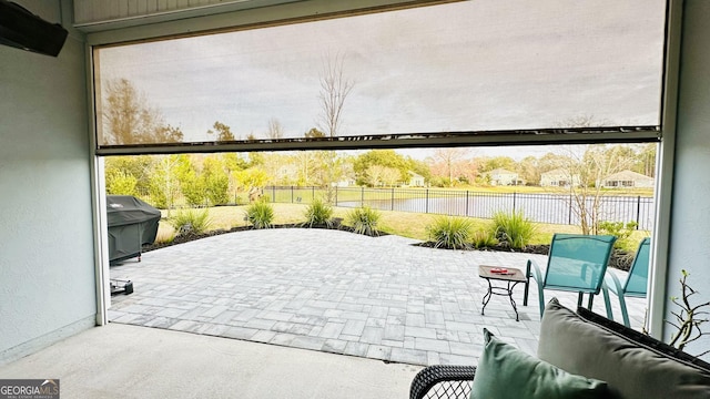 view of patio / terrace with grilling area and fence