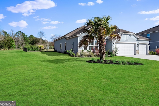 view of front of home with concrete driveway, a front lawn, and an attached garage