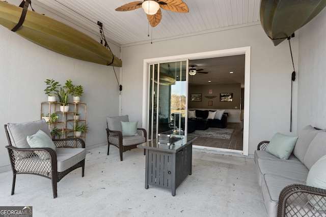 view of patio / terrace with an outdoor living space and a ceiling fan