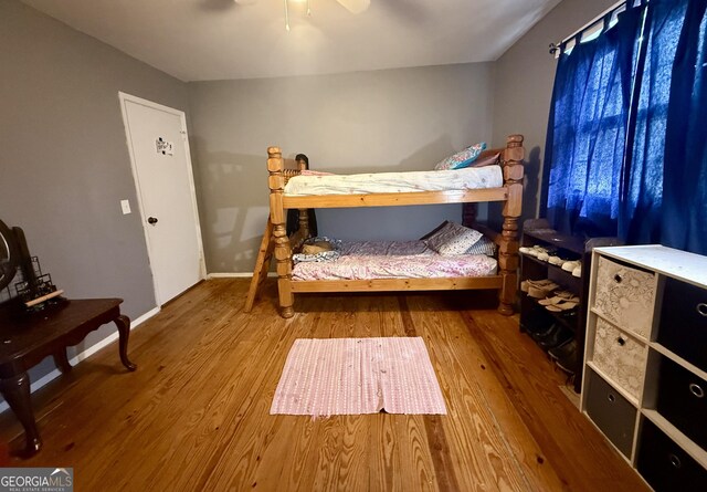 312 Schuman Dr, Bloomingdale, GA 31302 - bedroom featuring wood finished floors, baseboards, and a ceiling fan