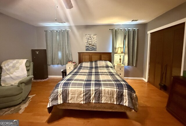 312 Schuman Dr, Bloomingdale, GA 31302 - bedroom featuring wood finished floors, ceiling fan, baseboards, and a closet