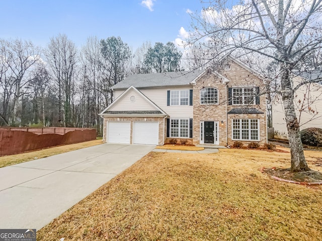 traditional-style house featuring brick siding, fence, a garage, driveway, and a front lawn