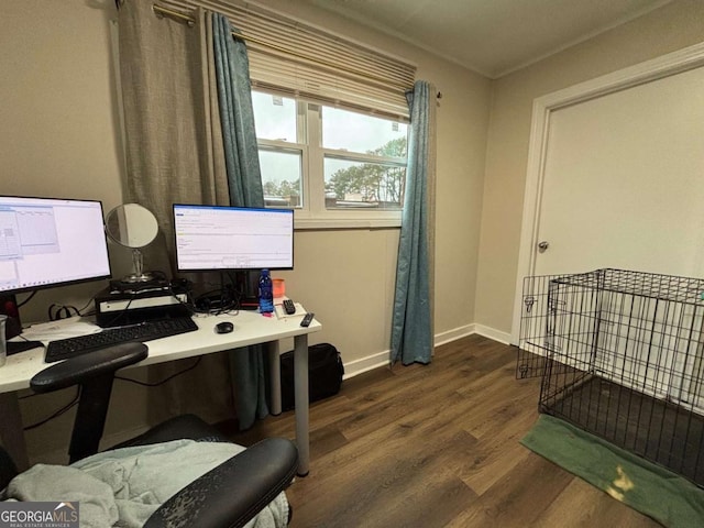 office area with dark wood-style floors and baseboards