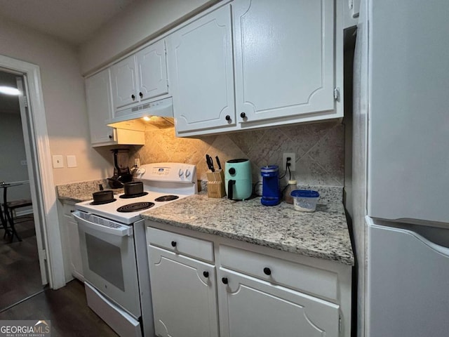 kitchen with electric range, white cabinets, freestanding refrigerator, under cabinet range hood, and backsplash