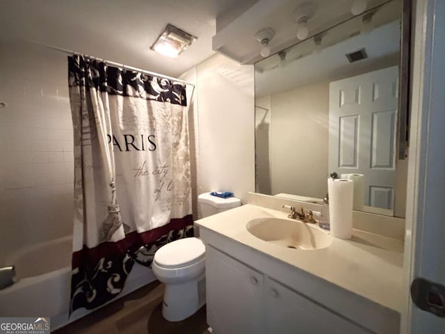 bathroom with visible vents, vanity, toilet, and shower / bath combo with shower curtain