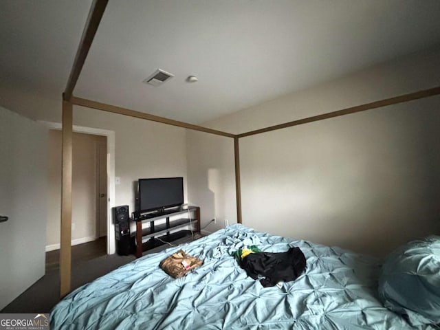 bedroom featuring visible vents