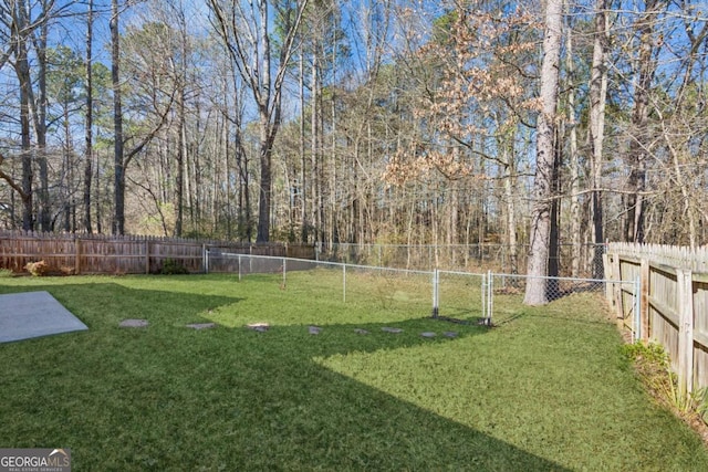 view of yard featuring a fenced backyard