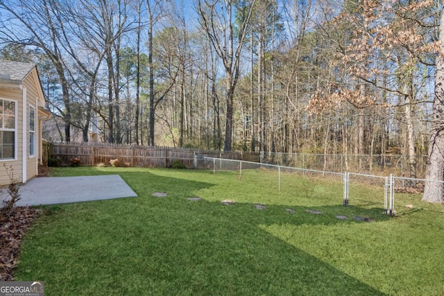 view of yard with a fenced backyard