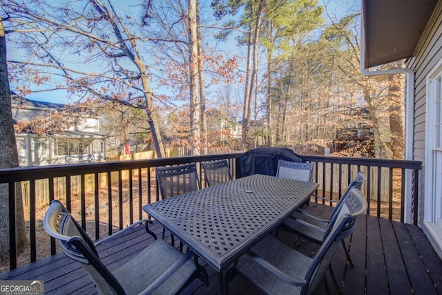 wooden deck with outdoor dining space