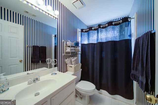 bathroom with curtained shower, vanity, toilet, and wallpapered walls