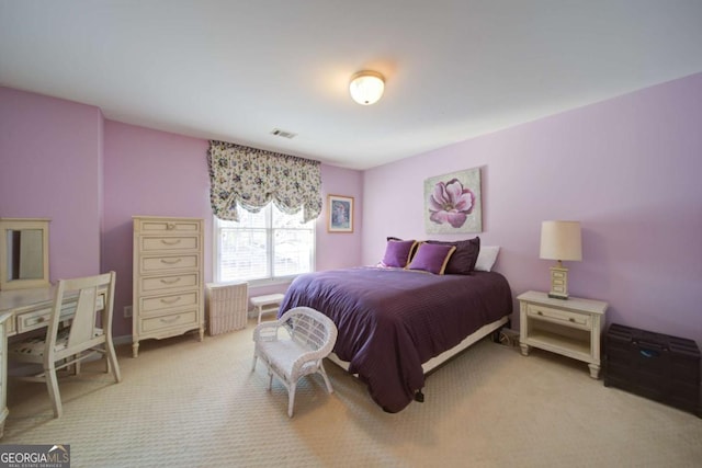 bedroom with light carpet and visible vents