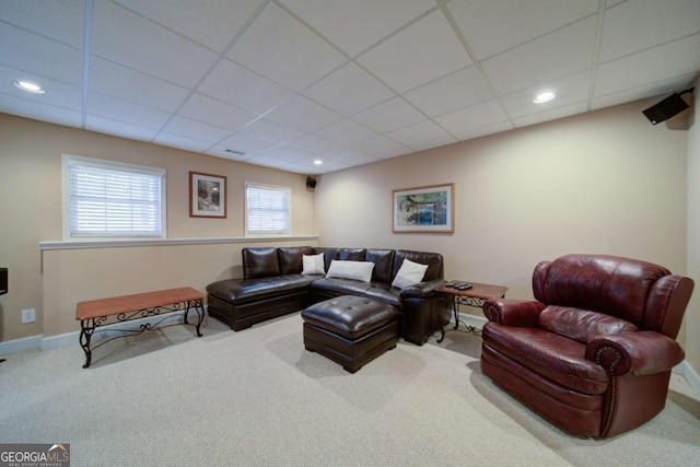 living area with carpet floors, baseboards, a drop ceiling, and recessed lighting