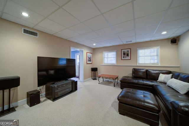 carpeted living area featuring recessed lighting, baseboards, visible vents, and a drop ceiling