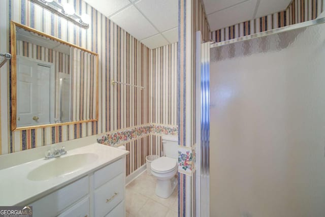 full bath with toilet, wallpapered walls, a shower stall, and tile patterned floors