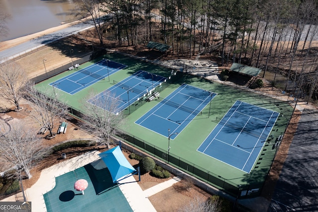 view of tennis court with fence